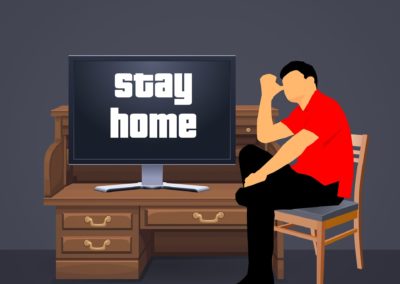 Man in home office with Stay Home Message on computer screen
